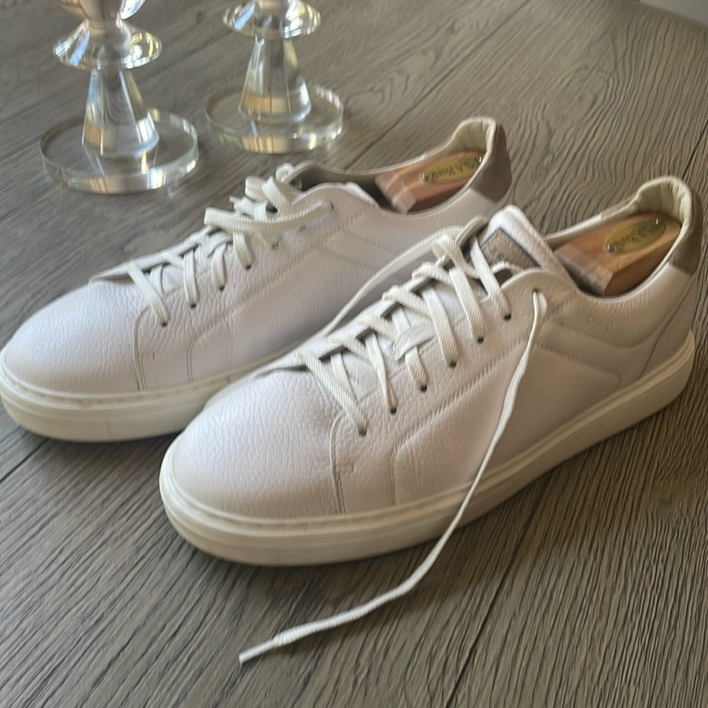 Like new Brunello Cucinelli white sneakers.  Great with jeans or dress slacks.